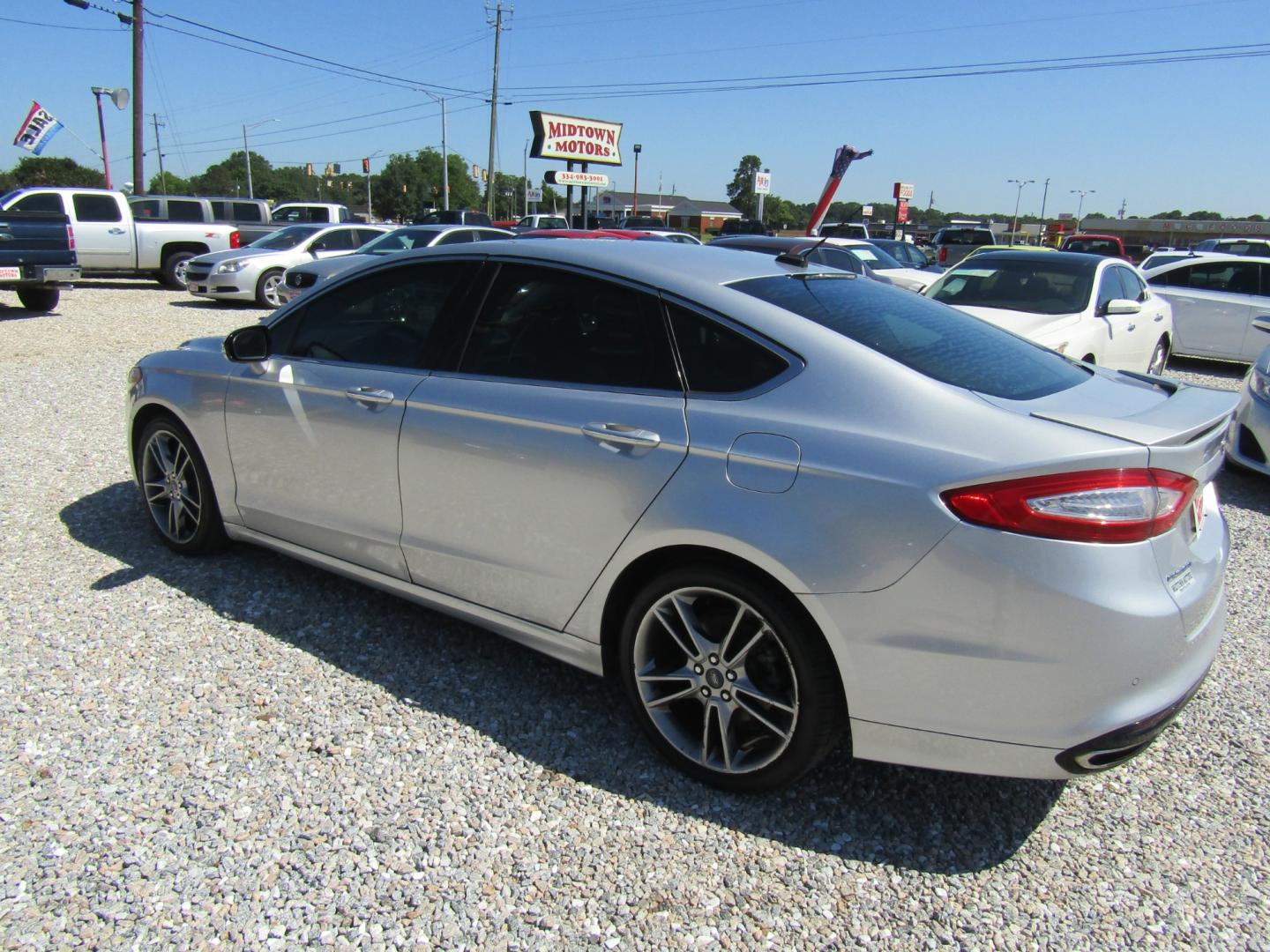 2016 Silver Ford Fusion Titanium (3FA6P0K96GR) with an 2.0L L4 DOHC 16V engine, Automatic transmission, located at 15016 S Hwy 231, Midland City, AL, 36350, (334) 983-3001, 31.306210, -85.495277 - Photo#5